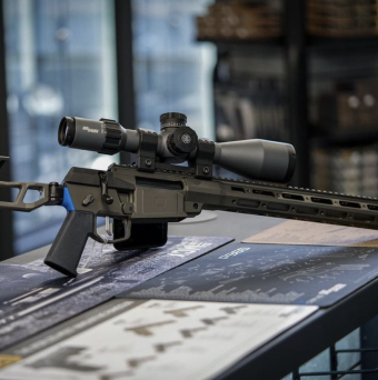 a rifle on the wooden table in the hub store lakeside