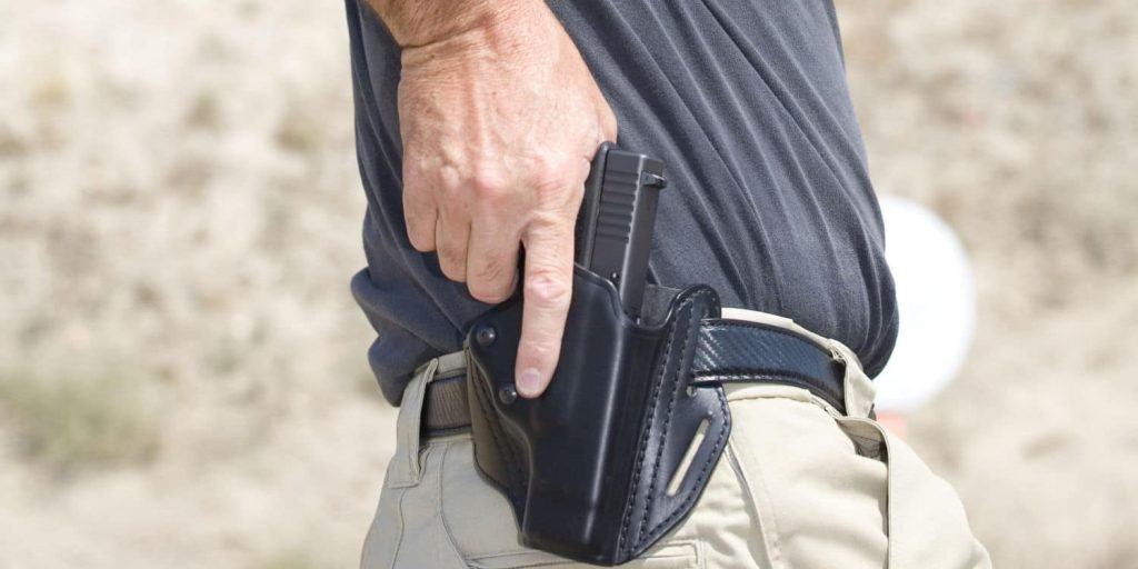 a man wearing a gun belt