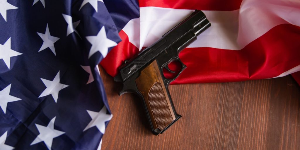 a firearm on an american flag