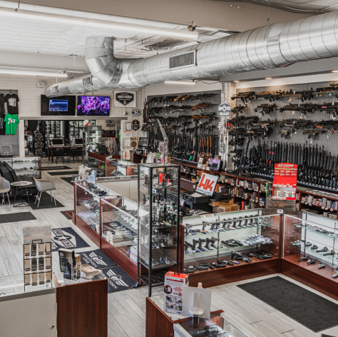 the hub gun store with guns and accessories from side view