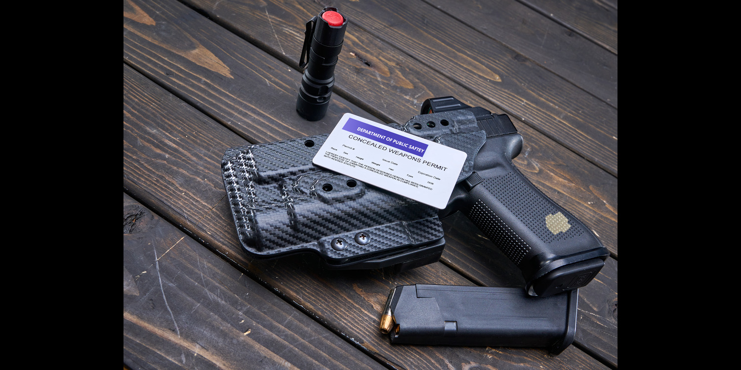 gun with conceal carry permit lying on the table