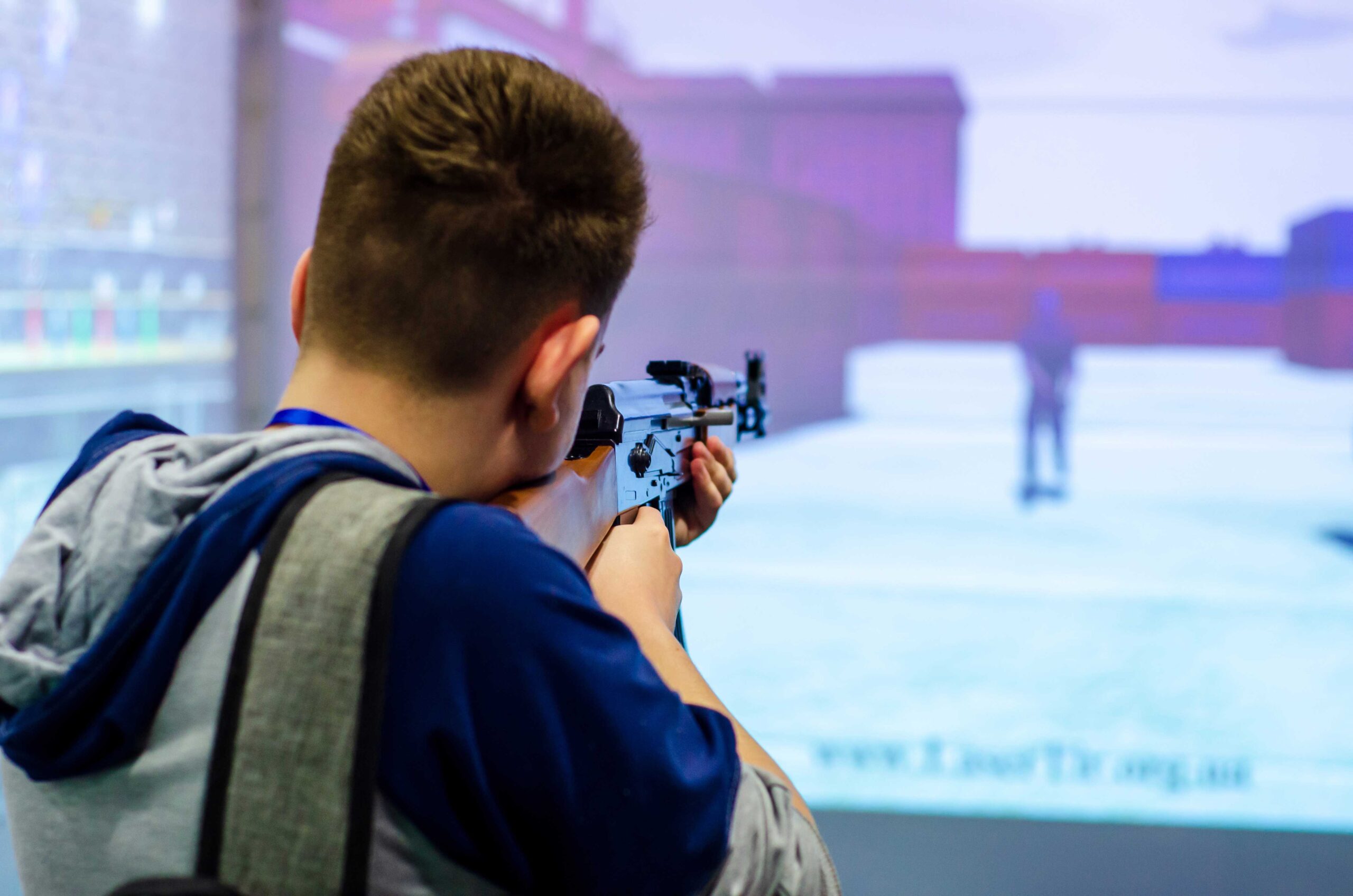 a man shooting at a Virtual Firearm Training center